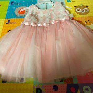 Pink and white dress with flowers on the top